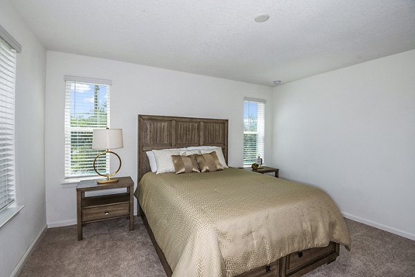 Bedroom with elegant design and modern furnishings at Alexander Park Apartments
