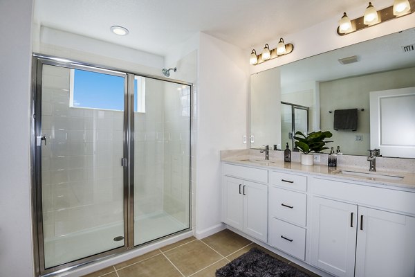Modern bathroom with elegant fixtures at Alexander Park Apartments in Greystar community