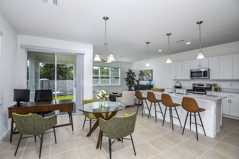 Dining room/home office featuring modern furnishings and elegant lighting in Alexander Park Apartments