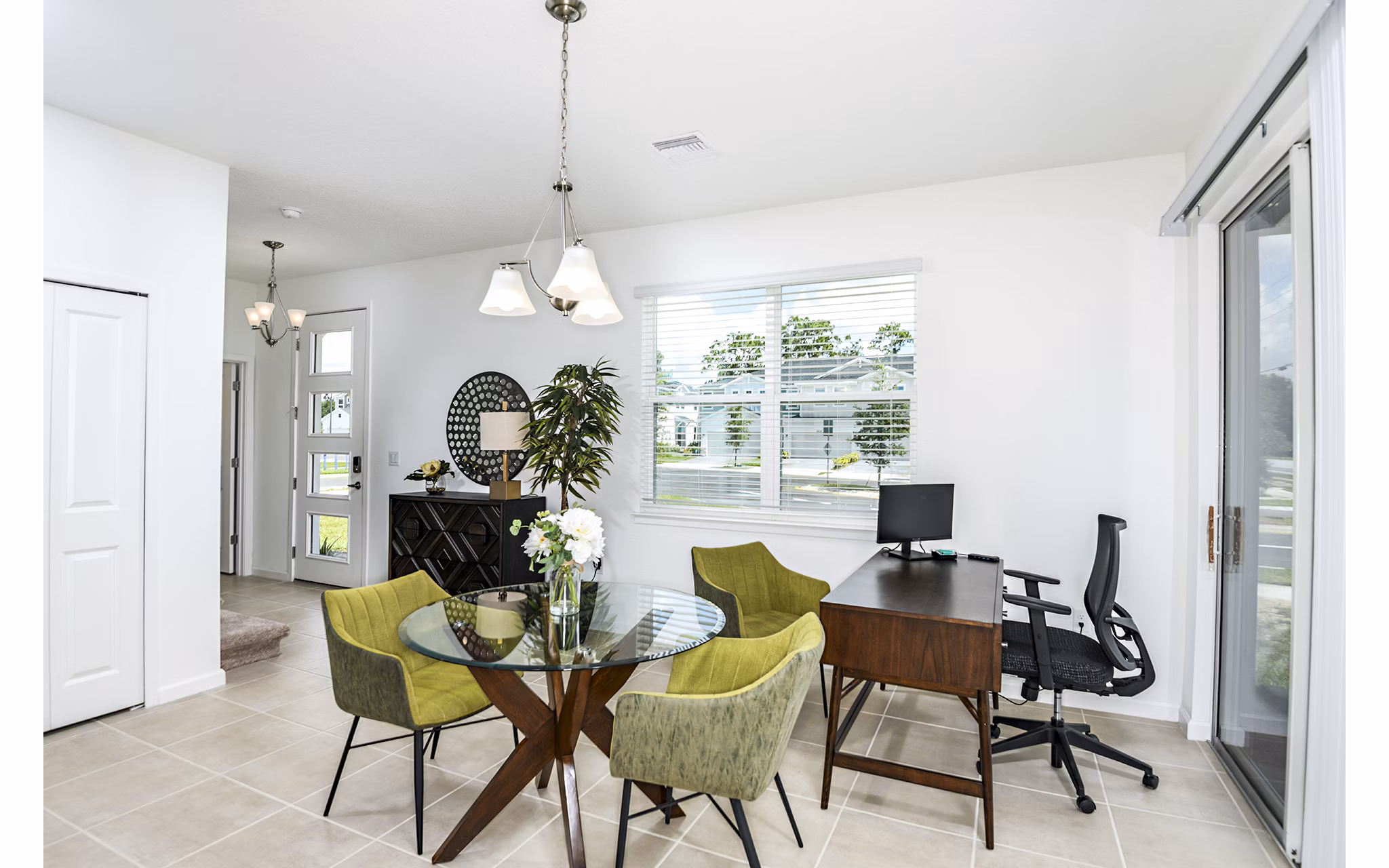 Dining room and home office combo at Alexander Park Apartments with modern decor and ample natural light