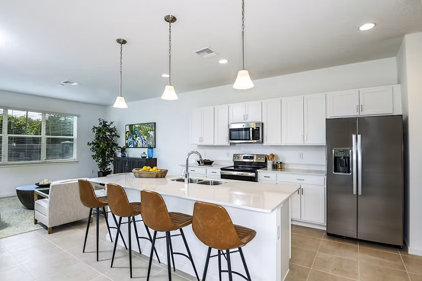 Modern kitchen with stainless steel appliances at Alexander Park Apartments