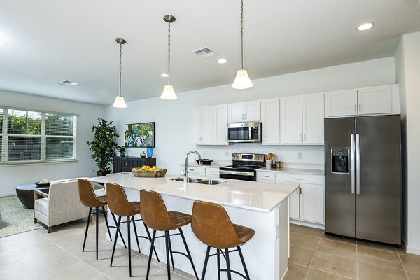Modern kitchen with stainless steel appliances at Alexander Park Apartments
