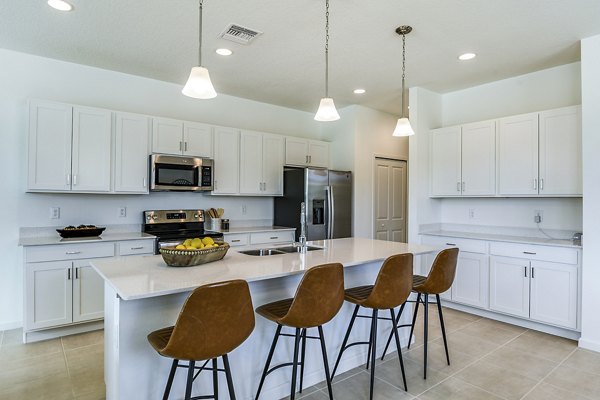 Modern kitchen with stainless steel appliances at Alexander Park Apartments