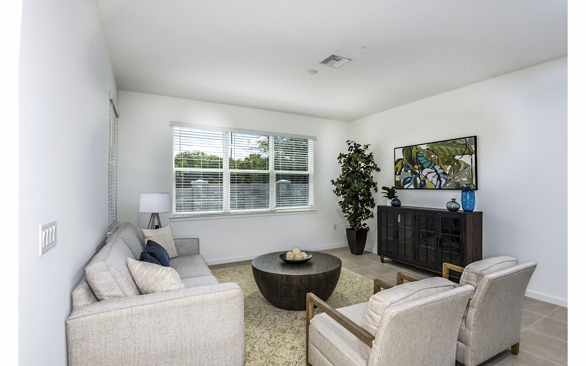Spacious living room with modern decor in Alexander Park Apartments