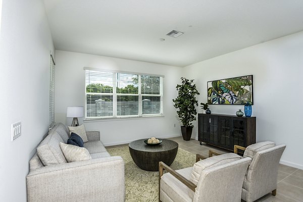 Spacious living room with modern decor in Alexander Park Apartments