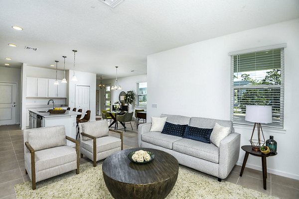 Living room with modern decor and natural light at Alexander Park Apartments