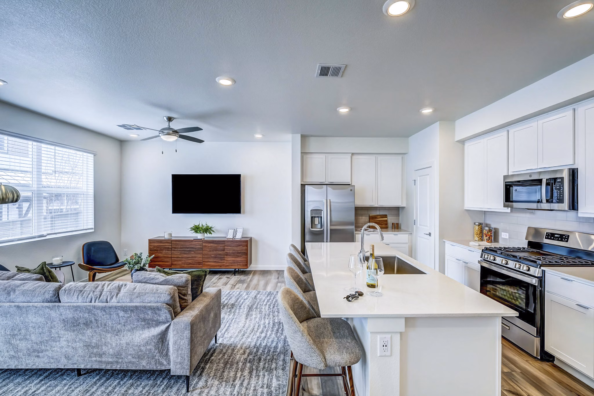 kitchen and living room at VellaTerra Apartment