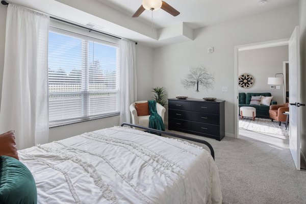 Cozy bedroom with modern decor at Arasan Apartments