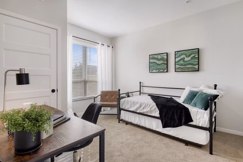 Bedroom with plush bedding and stylish decor at Arasan Apartments, offering luxury living and comfort in a sought-after location