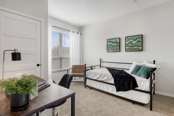 Bedroom with plush bedding and stylish decor at Arasan Apartments, offering luxury living and comfort in a sought-after location
