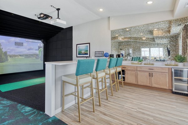 Contemporary clubhouse with lounge seating and modern design at Arasan Apartments