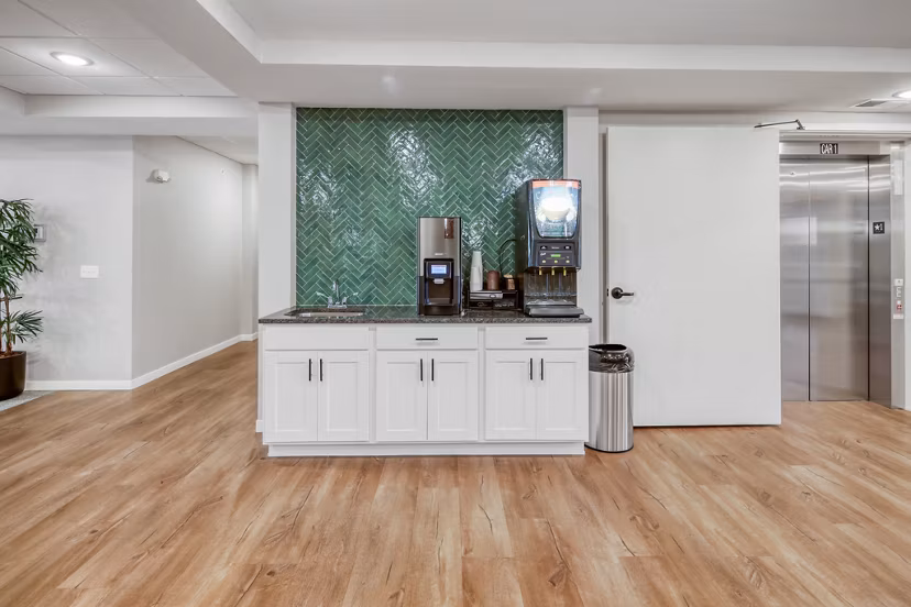 Clubhouse featuring modern design and seating at Arasan Apartments
