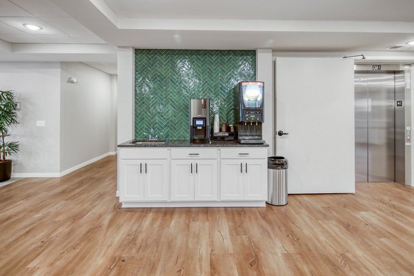 Clubhouse featuring modern design and seating at Arasan Apartments