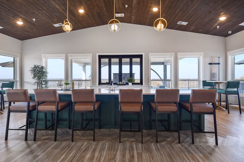 Chic clubhouse with modern furnishings at Arasan Apartments, ideal for social gatherings and relaxation