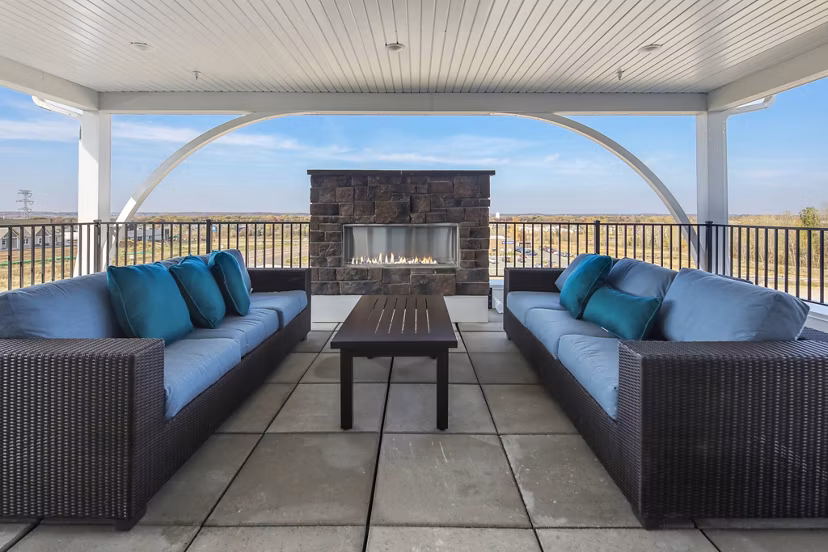 Cozy fire pit at Arasan Apartments offering a relaxing outdoor amenity for residents