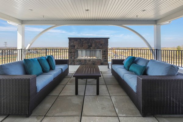 Cozy fire pit at Arasan Apartments offering a relaxing outdoor amenity for residents