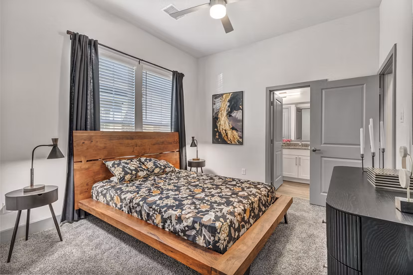 Relaxing bedroom with contemporary decor at Preserve at Highway 6 Apartments, perfect for comfortable living and a tranquil escape