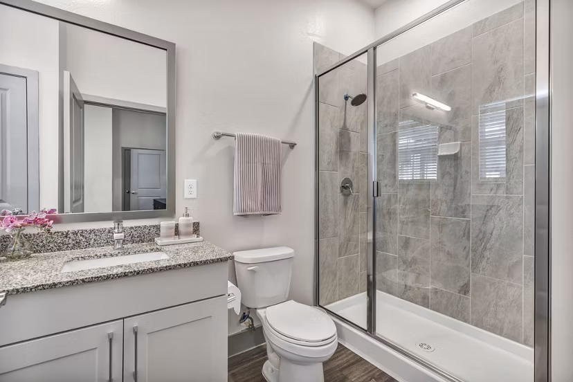 Modern bathroom with sleek fixtures at Preserve at Highway 6 Apartments