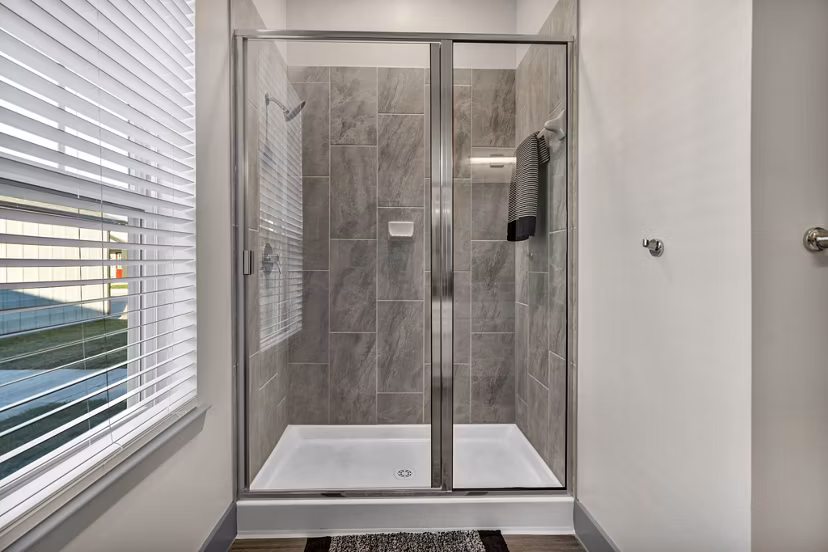 Modern bathroom with elegant fixtures at Preserve at Highway 6 Apartments