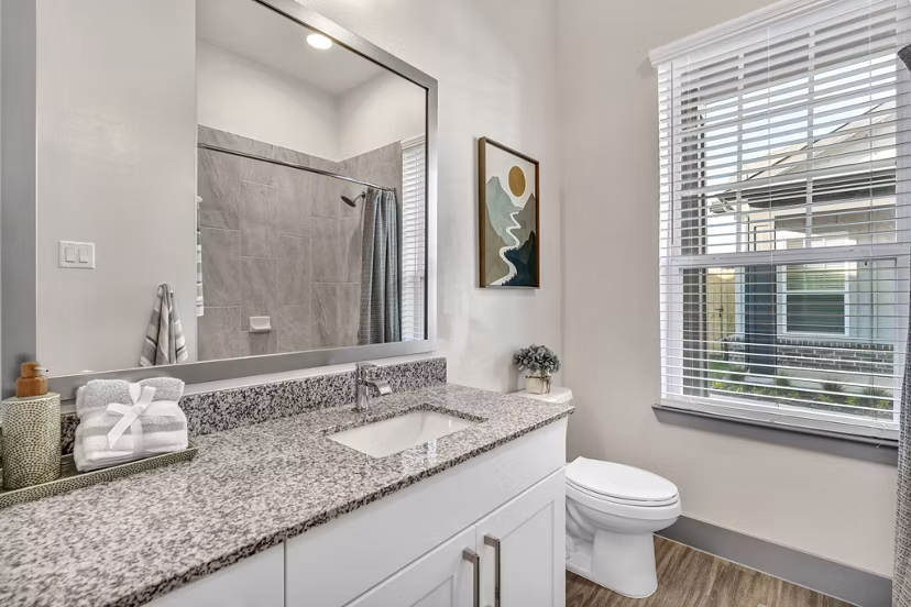 Modern bathroom with sleek fixtures at Preserve at Highway 6 Apartments featuring spa-inspired design