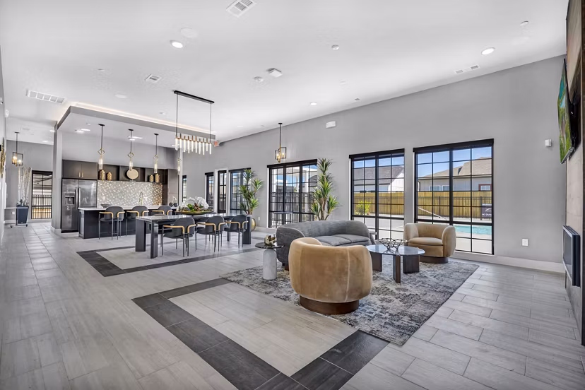 Clubhouse featuring modern lounge areas at Preserve at Highway 6 Apartments