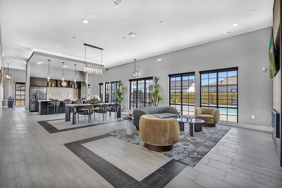 Clubhouse featuring modern lounge areas at Preserve at Highway 6 Apartments