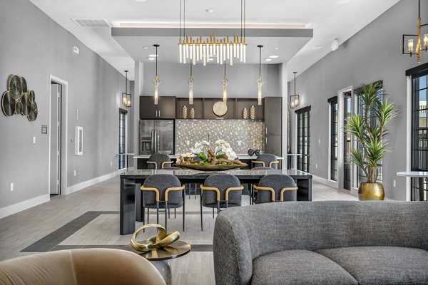 Clubhouse featuring modern design and plush seating at Preserve at Highway 6 Apartments