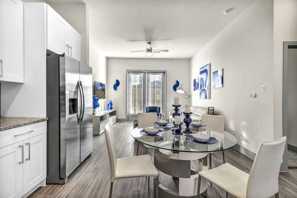 Dining area with modern decor and seating at Preserve at Highway 6 Apartments, ideal for gatherings and meals