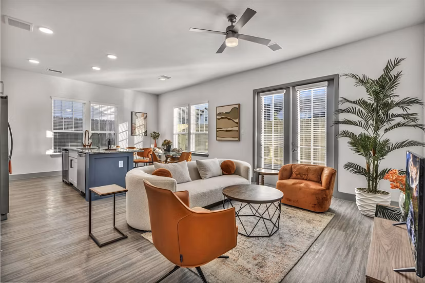 Living room with modern decor and natural light at Preserve at Highway 6 Apartments