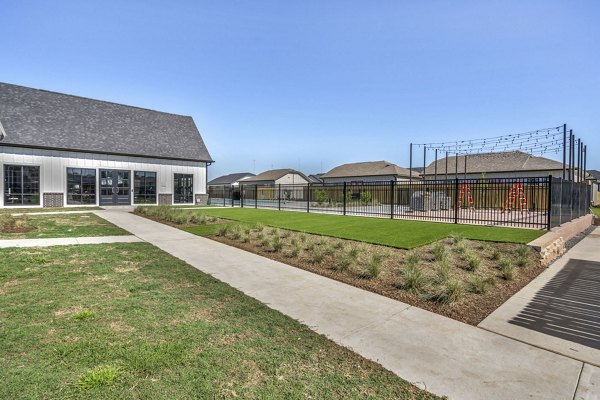 Spacious courtyard featuring lush landscaping at Preserve at Highway 6 Apartments