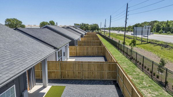 Exterior view of Preserve at Highway 6: Luxury apartment community with lush landscaping in Houston