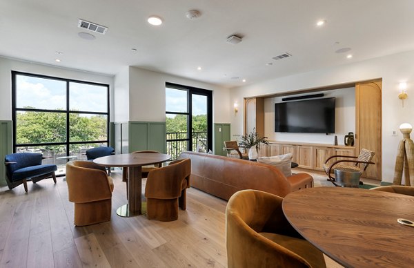 Clubhouse featuring modern design and comfy seating at Windsor Commons Apartments