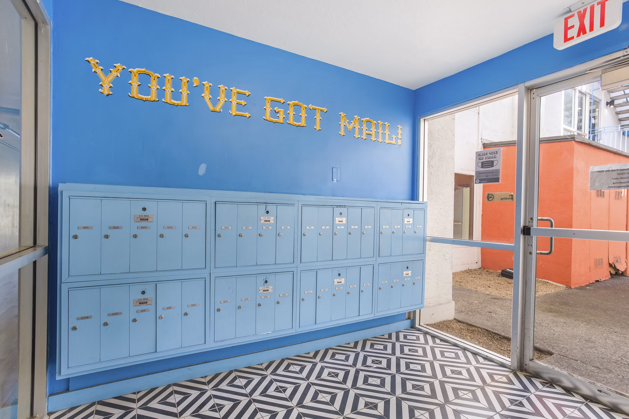 Efficient mail room with package lockers at Fremont City Center Apartments, ensuring secure delivery for residents