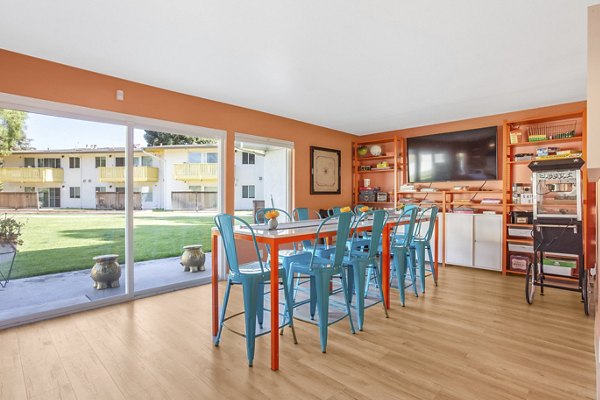 Clubhouse with modern furnishings at Fremont City Center Apartments featuring luxury amenities