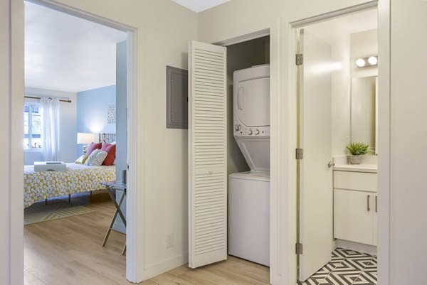 Bright hallway with modern lighting and sleek flooring at Fremont City Center Apartments