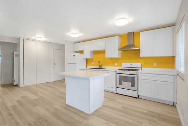 Modern kitchen with stainless steel appliances in Fremont City Center Apartments