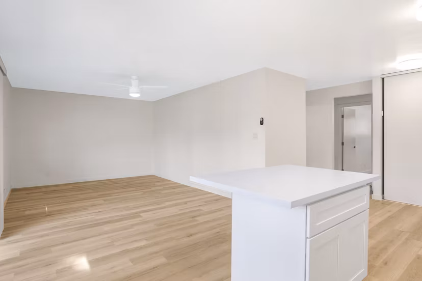 Open-concept kitchen with stainless steel appliances in Fremont City Center Apartments