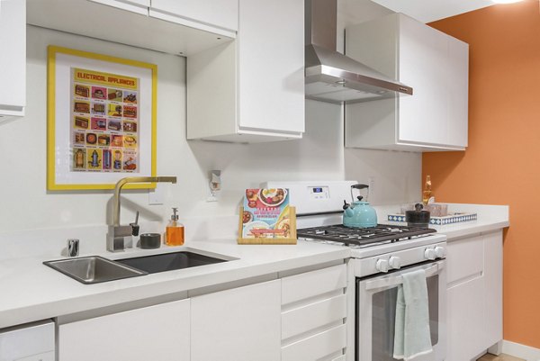 Modern kitchen with stainless steel appliances at Fremont City Center Apartments