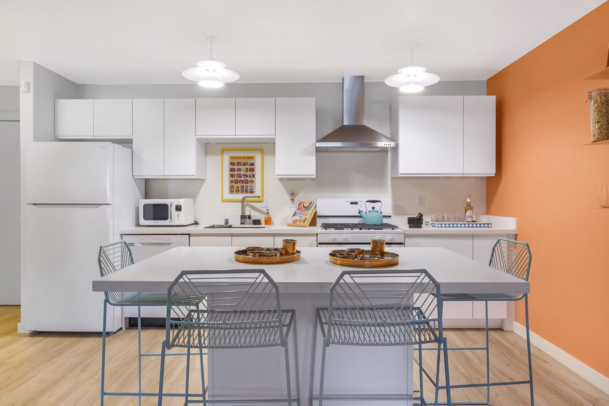 Open-concept kitchen featuring modern appliances at Fremont City Center Apartments