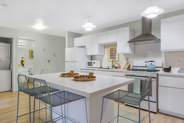 Modern kitchen with sleek countertops and stainless steel appliances at Fremont City Center Apartments, available for rent now