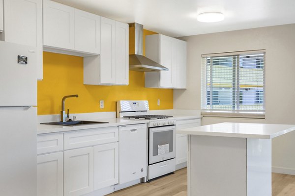 Modern kitchen with stainless steel appliances at Fremont City Center Apartments