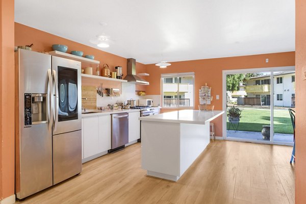 Modern kitchen featuring sleek countertops and stainless steel appliances at Fremont City Center Apartments