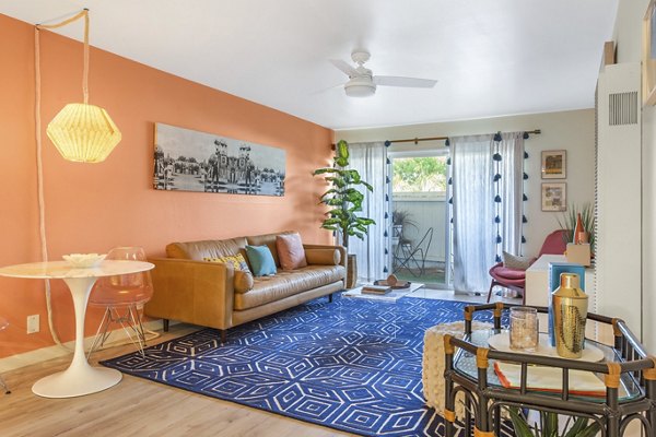 Cozy living room with modern furnishings at Fremont City Center Apartments