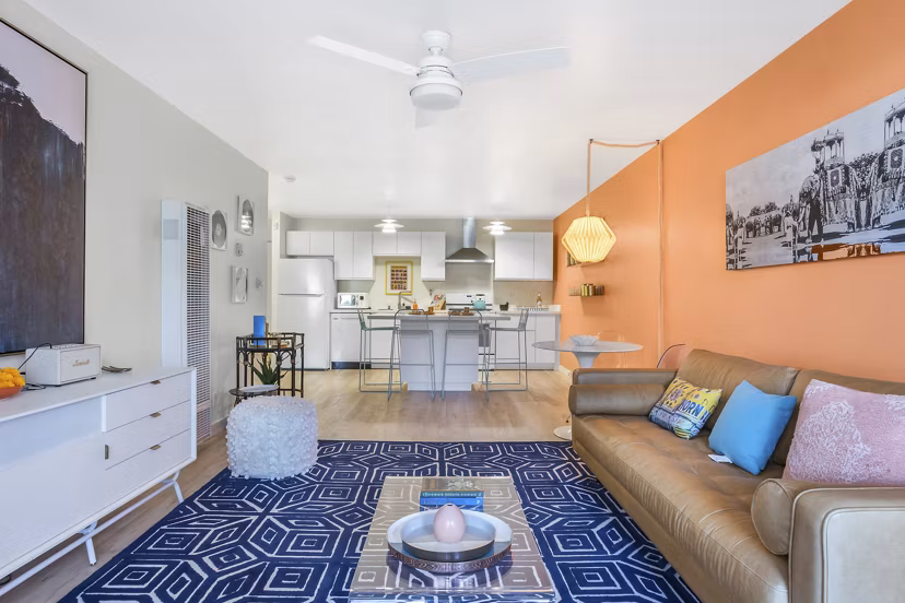 Spacious living room with modern decor in Fremont City Center Apartments, showcasing comfort and style in luxury urban living