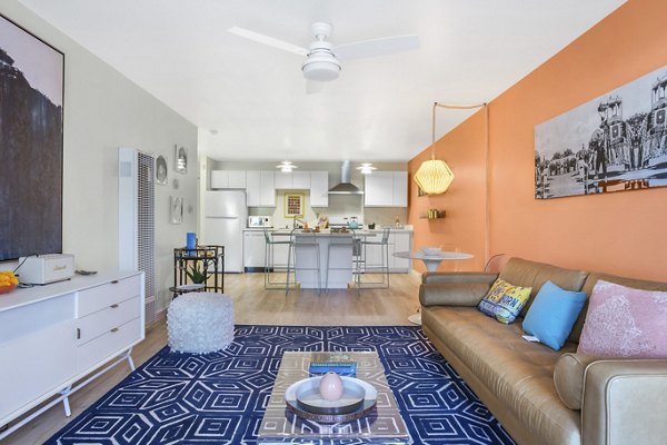 Spacious living room with modern decor in Fremont City Center Apartments, showcasing comfort and style in luxury urban living