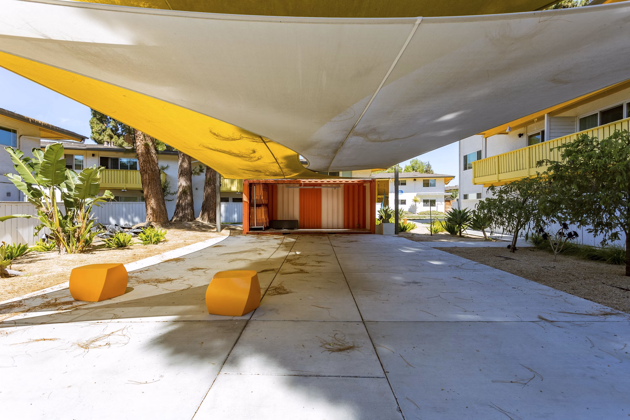 Spacious patio with seating and greenery at Fremont City Center Apartments, offering a serene outdoor retreat for relaxation