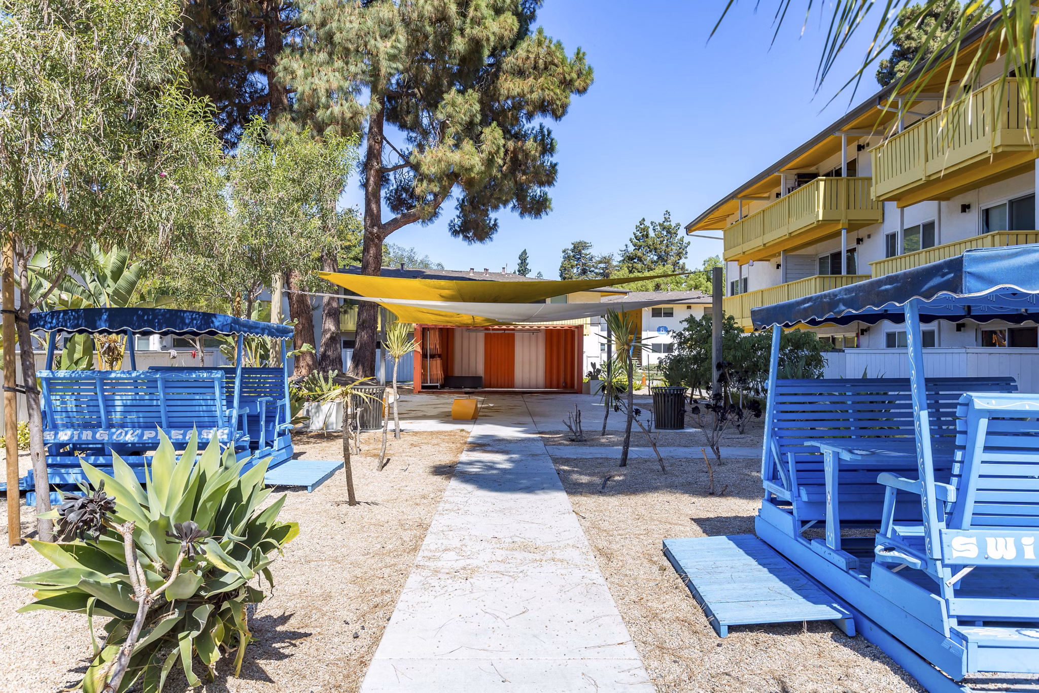 Tranquil courtyard with lush landscaping at Fremont City Center Apartments, a Greystar luxury property in urban setting