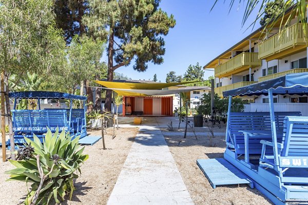 Tranquil courtyard with lush landscaping at Fremont City Center Apartments, a Greystar luxury property in urban setting