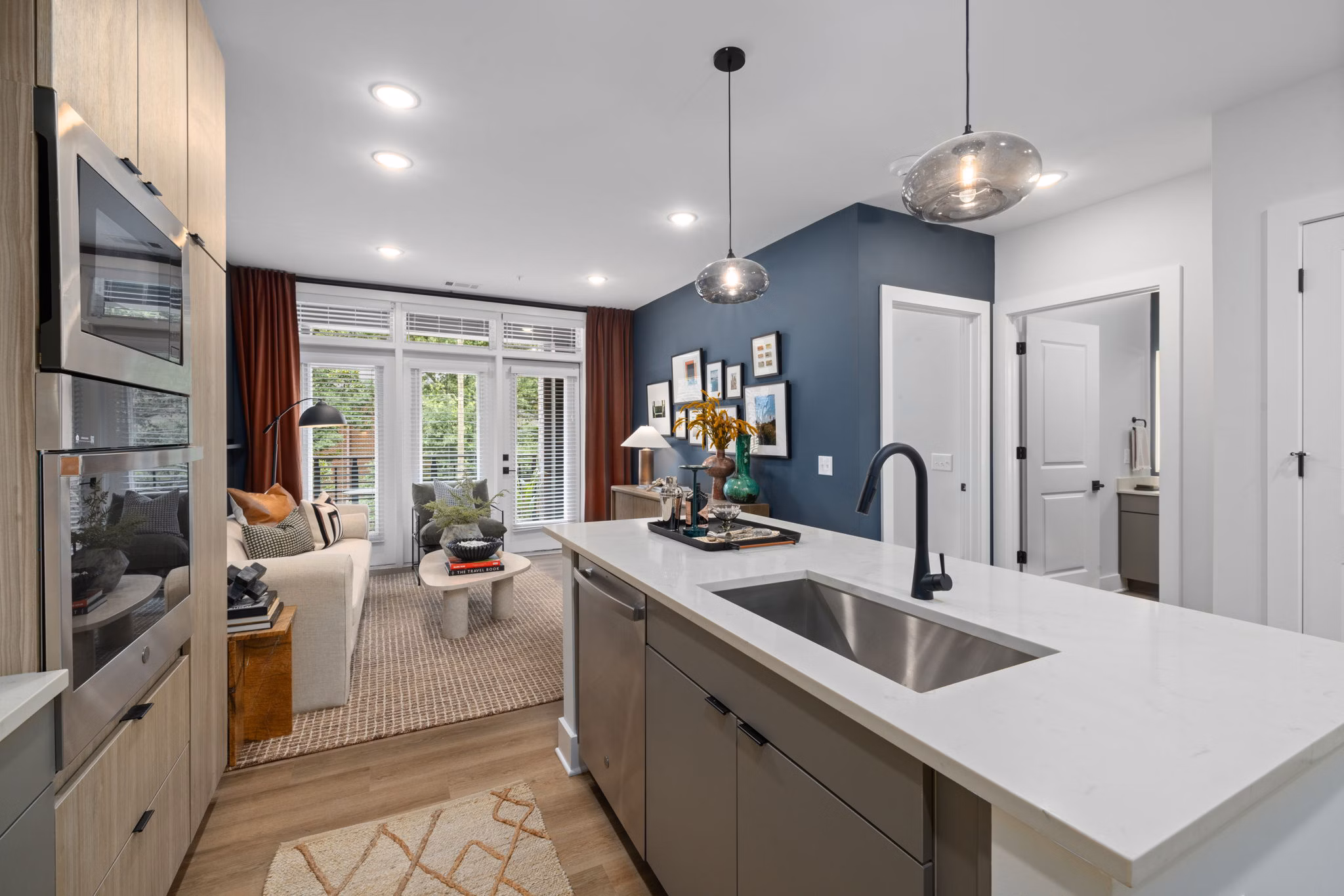 Modern kitchen with stainless steel appliances and sleek countertops at The Point Apartments