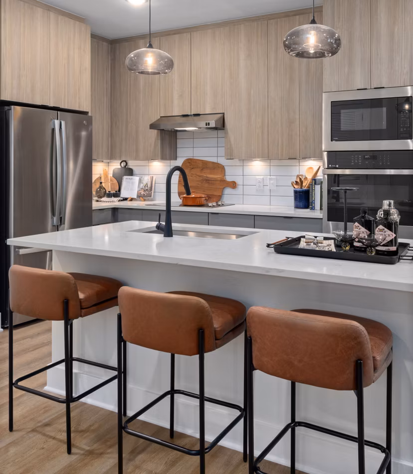 The Point Apartments: Modern kitchen with stainless steel appliances and sleek countertops